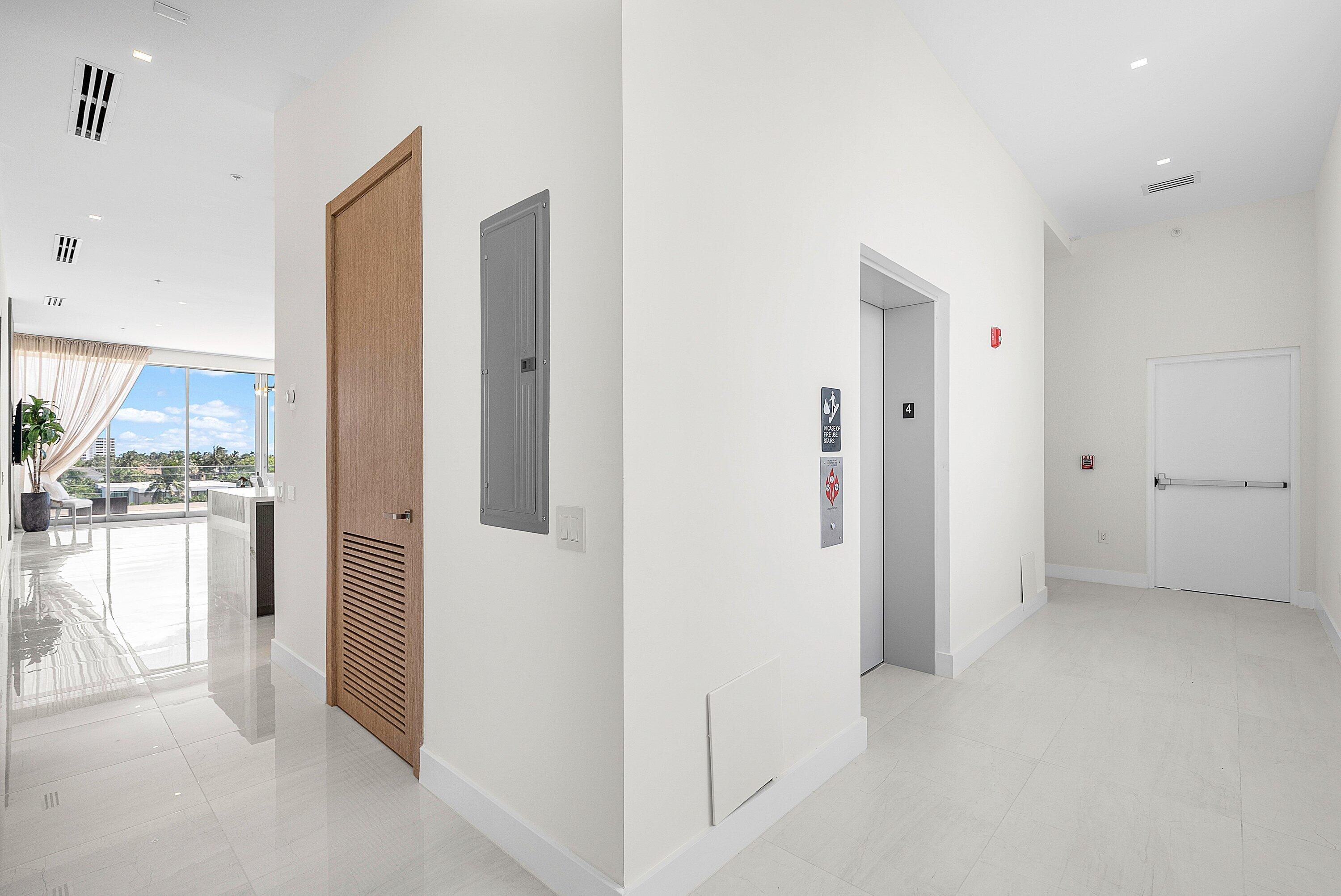 246 Northeast 6th Avenue, Unit PH Delray Beach, FL 33483 - Photo 30 of 36 a view of a kitchen with a refrigerator and a stove