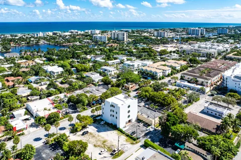 an aerial view of residential houses with city view
