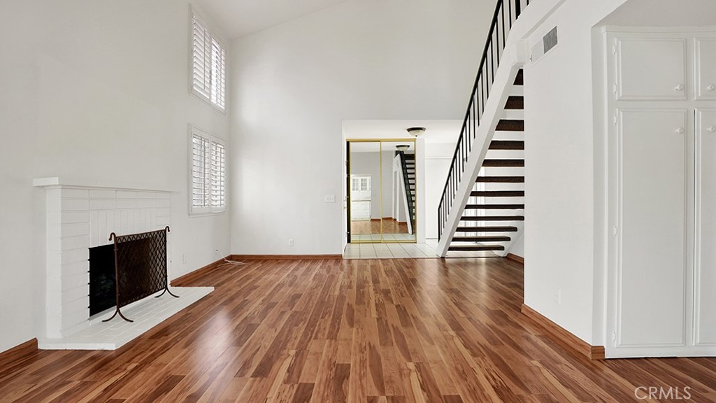 2909 Pinewood Court Fullerton, CA 92835 - Photo 12 of 33 a view of a livingroom with wooden floor and staircase