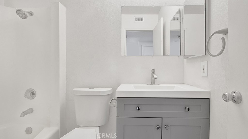 2909 Pinewood Court Fullerton, CA 92835 - Photo 20 of 33 a bathroom with a sink a toilet and shower