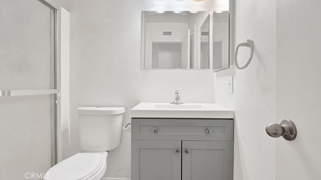 2909 Pinewood Court Fullerton, CA 92835 - Photo 25 of 33 a bathroom with a toilet sink and mirror