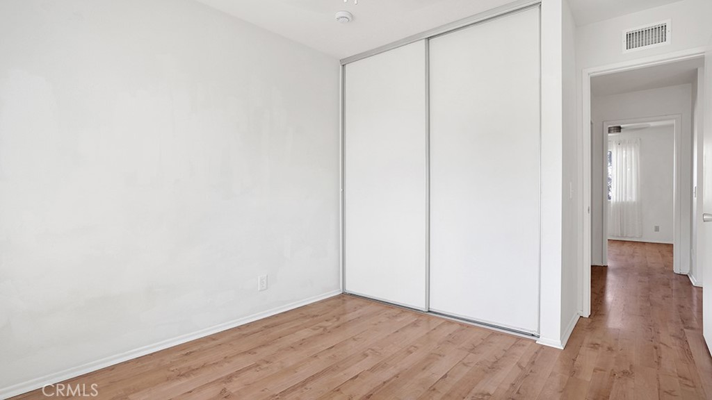 2909 Pinewood Court Fullerton, CA 92835 - Photo 28 of 33 a view of an empty room with wooden floor