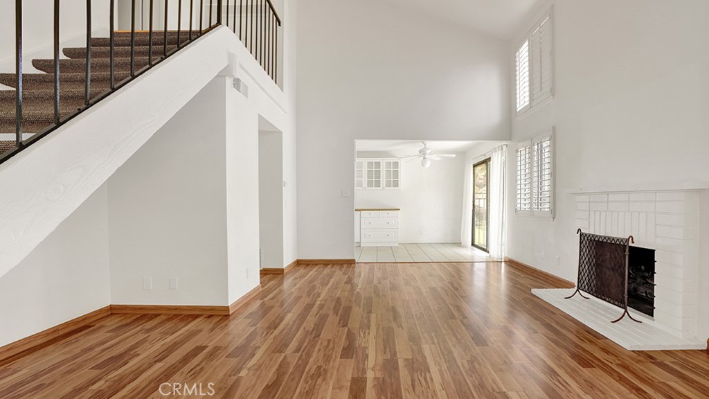 2909 Pinewood Court Fullerton, CA 92835 - Photo 5 of 33 a view of a livingroom with wooden floor and staircase