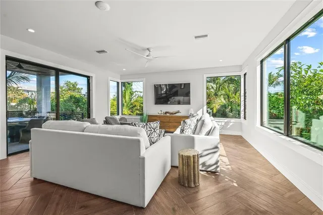 a view of a chair and table in backyard of the house