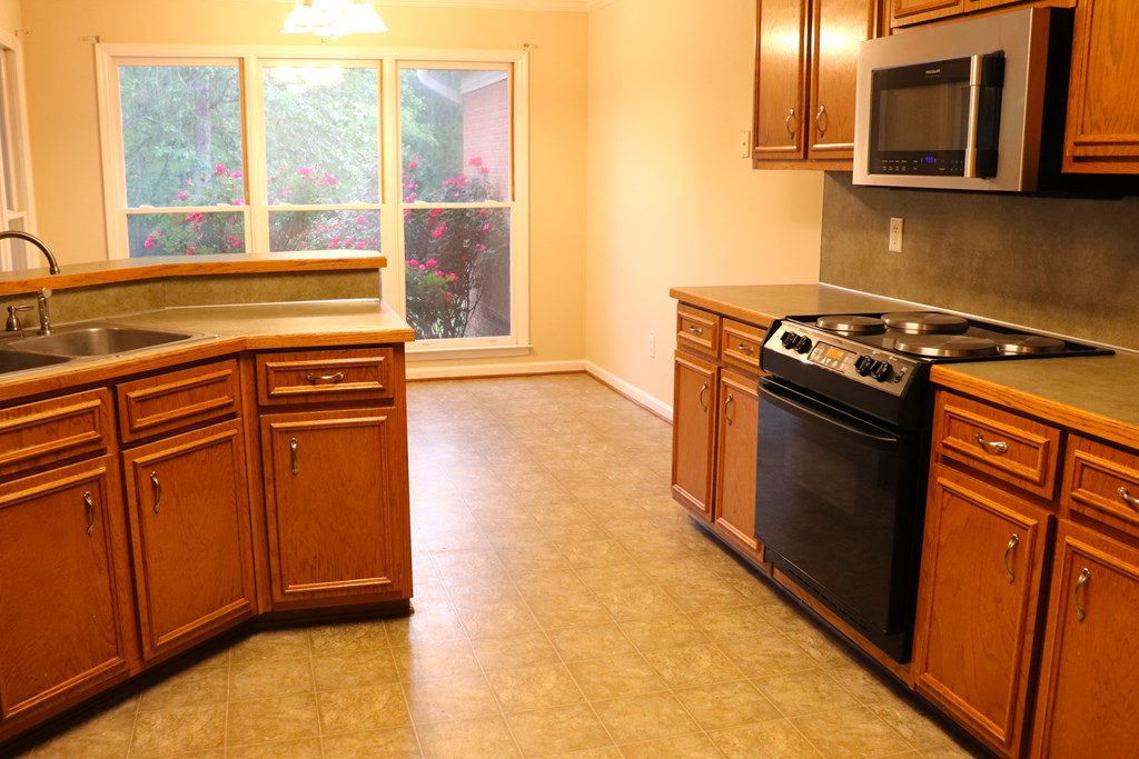 6008 Walters Loop Columbus, GA 31907 - Photo 11 of 33 a view of a kitchen with a sink and cabinets