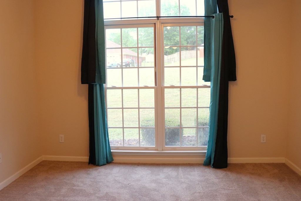 6008 Walters Loop Columbus, GA 31907 - Photo 14 of 33 an empty room with wooden floor and windows