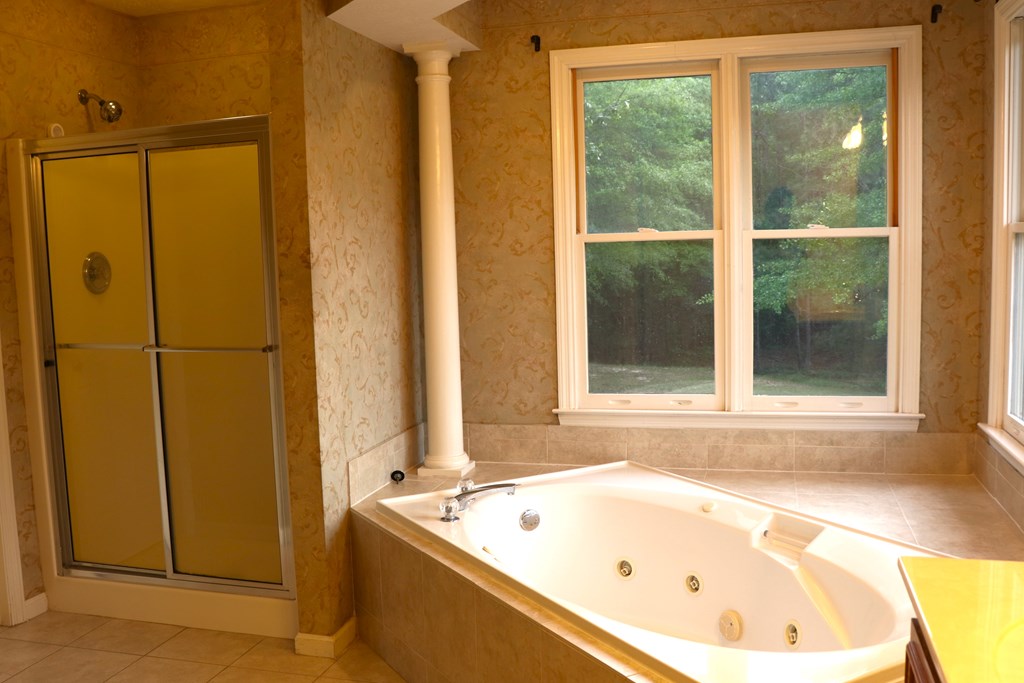 6008 Walters Loop Columbus, GA 31907 - Photo 20 of 33 a bathroom with a bathtub and shower