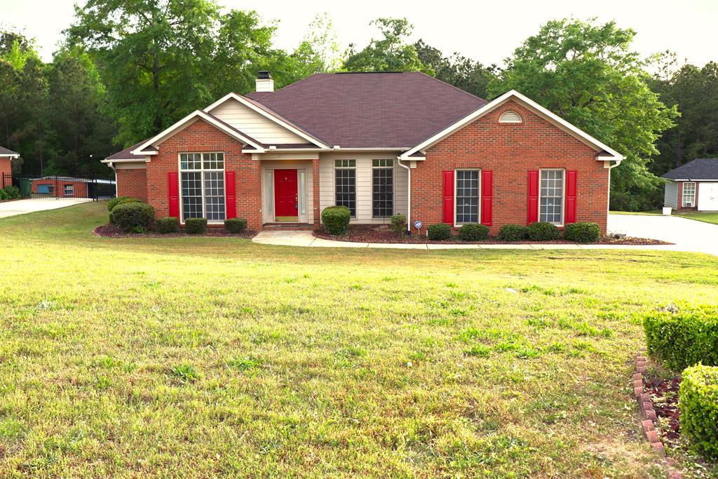 6008 Walters Loop Columbus, GA 31907 - Photo 2 of 33 a front view of a house with swimming pool