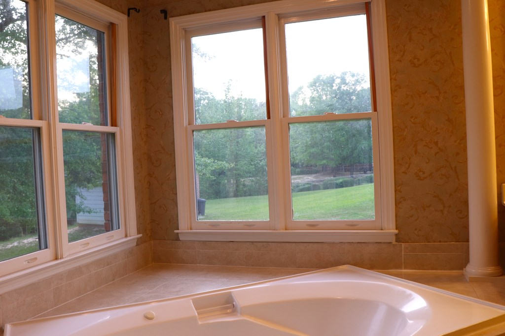 6008 Walters Loop Columbus, GA 31907 - Photo 21 of 33 a bathroom with a bathtub and window