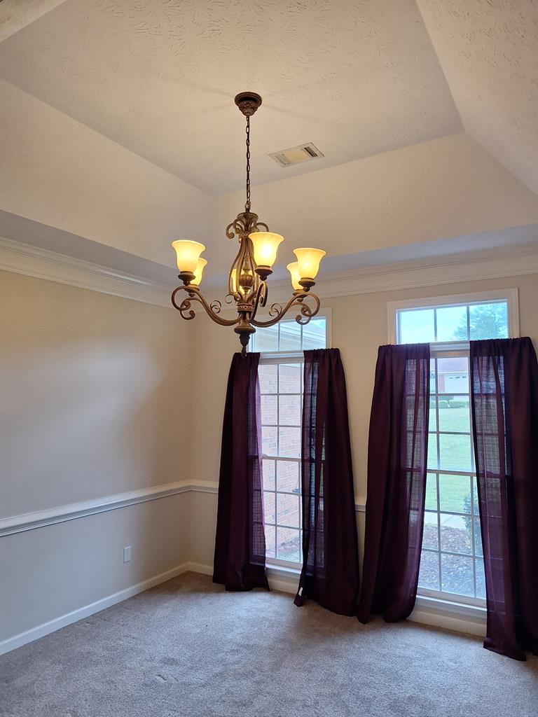 6008 Walters Loop Columbus, GA 31907 - Photo 8 of 33 a view of a chandelier fan and fire place