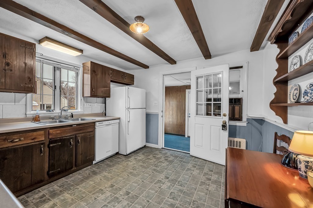 20 Lenox Road Holyoke, MA 01040 - Photo 15 of 36 a kitchen with refrigerator cabinets and wooden floor