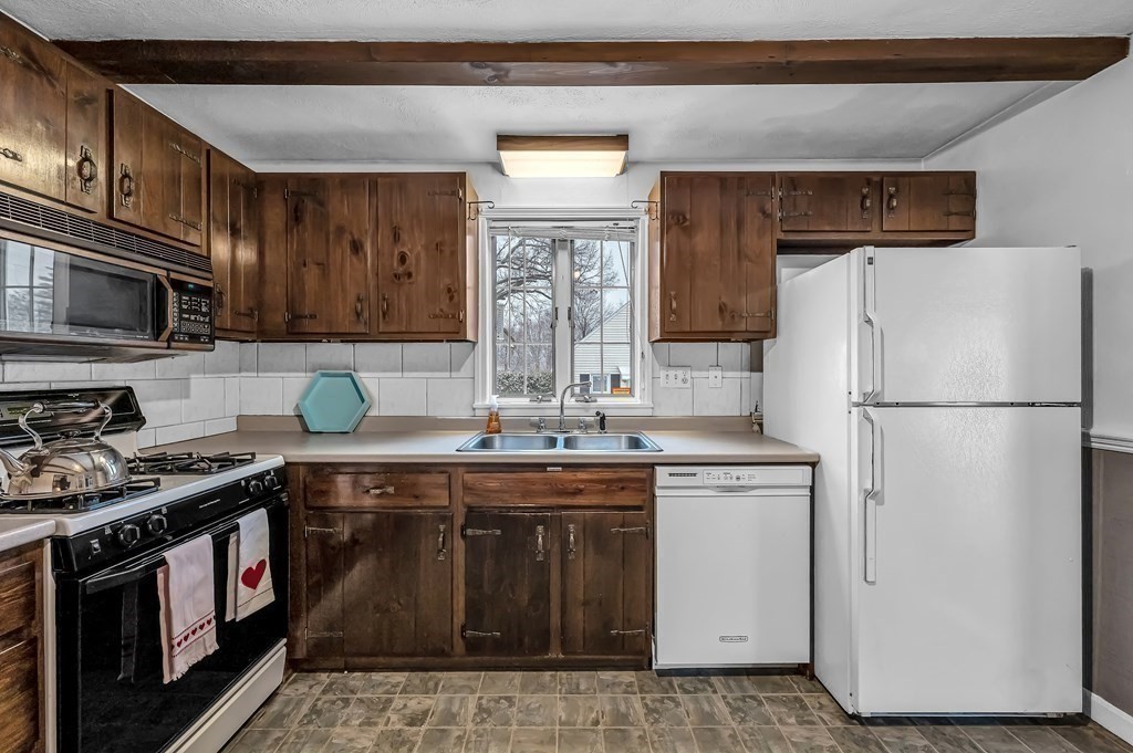 20 Lenox Road Holyoke, MA 01040 - Photo 16 of 36 a kitchen with a sink stove and refrigerator