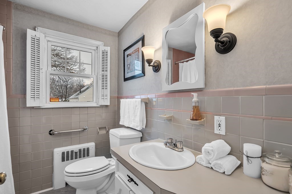 20 Lenox Road Holyoke, MA 01040 - Photo 18 of 36 a bathroom with a toilet sink and mirror