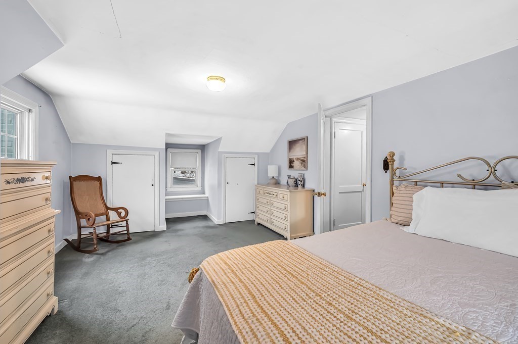20 Lenox Road Holyoke, MA 01040 - Photo 22 of 36 a bedroom with a bed and a chair