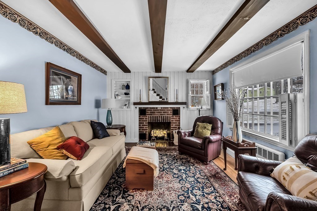 20 Lenox Road Holyoke, MA 01040 - Photo 3 of 36 a living room with furniture a fireplace and a large window
