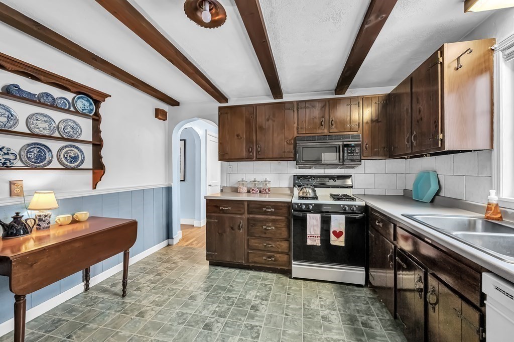 20 Lenox Road Holyoke, MA 01040 - Photo 5 of 36 a kitchen with stainless steel appliances granite countertop a stove a sink and a refrigerator