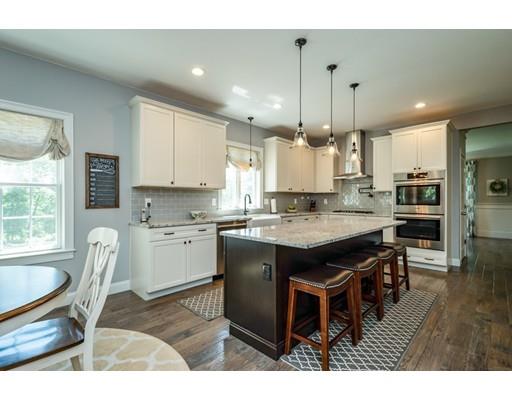 320 West Acton Road Stow, MA 01775 - Photo 12 of 39 a large kitchen with a table and chairs