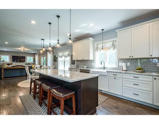 320 West Acton Road Stow, MA 01775 - Photo 2 of 39 a kitchen with kitchen island granite countertop a sink table and chairs