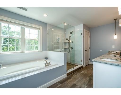 320 West Acton Road Stow, MA 01775 - Photo 21 of 39 a spacious bathroom with a tub sink shower and a mirror