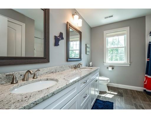 320 West Acton Road Stow, MA 01775 - Photo 23 of 39 a bathroom with a granite countertop sink a large mirror a and window