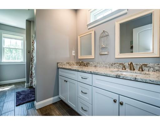 320 West Acton Road Stow, MA 01775 - Photo 30 of 39 a bathroom with a granite countertop sink and a mirror