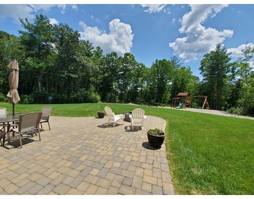320 West Acton Road Stow, MA 01775 - Photo 3 of 39 a view of a table and chairs in the garden