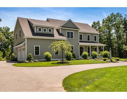 320 West Acton Road Stow, MA 01775 - Photo 34 of 39 a front view of a house with a yard and trees