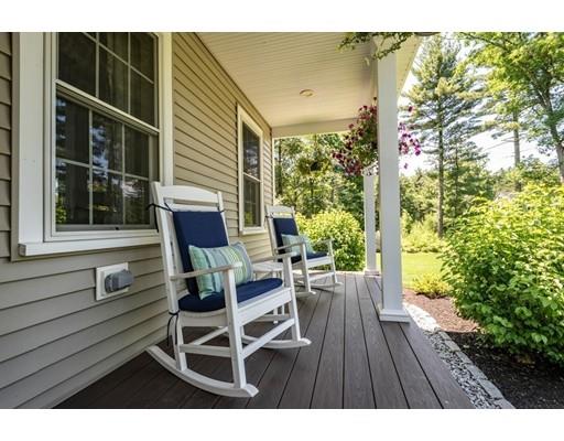 320 West Acton Road Stow, MA 01775 - Photo 4 of 39 a balcony with table and chairs