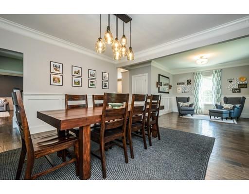 320 West Acton Road Stow, MA 01775 - Photo 8 of 39 a view of a dining room with furniture and chandelier
