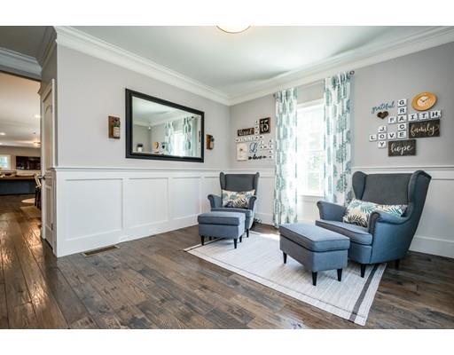 320 West Acton Road Stow, MA 01775 - Photo 9 of 39 a living room with furniture and a large window