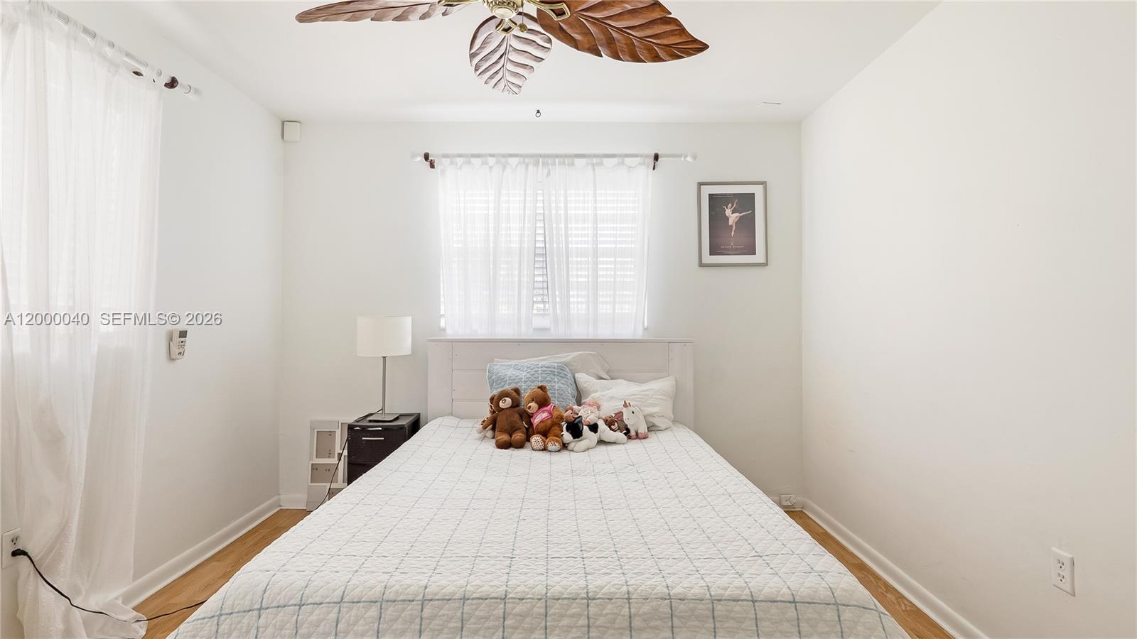 4020 Southwest 2nd Street Plantation, FL 33317 - Photo 14 of 43 a bedroom with a bed and a window