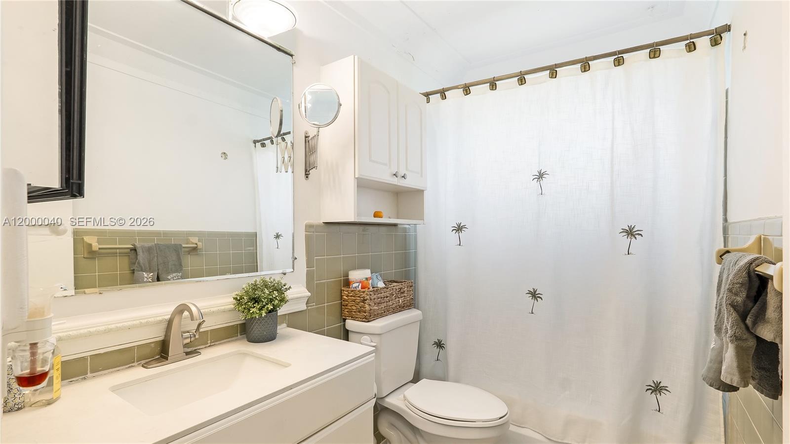 4020 Southwest 2nd Street Plantation, FL 33317 - Photo 15 of 43 a bathroom with a sink a toilet and shower
