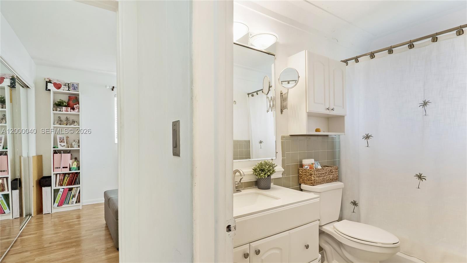 4020 Southwest 2nd Street Plantation, FL 33317 - Photo 16 of 43 a bathroom with a sink a toilet and shower curtain