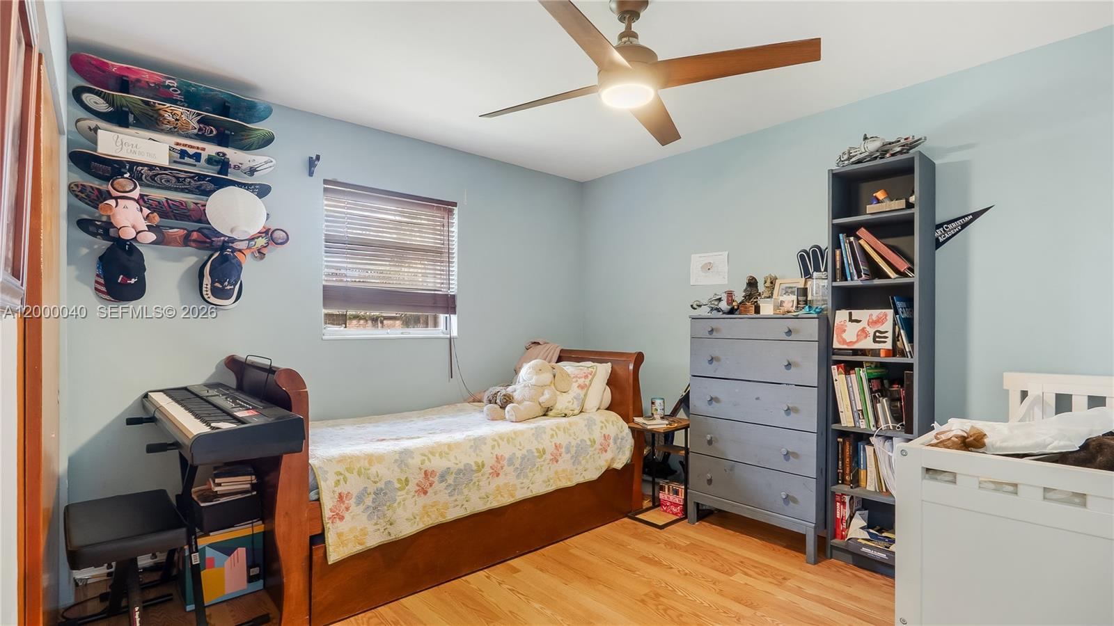 4020 Southwest 2nd Street Plantation, FL 33317 - Photo 17 of 43 a bedroom with a bed and a book shelf