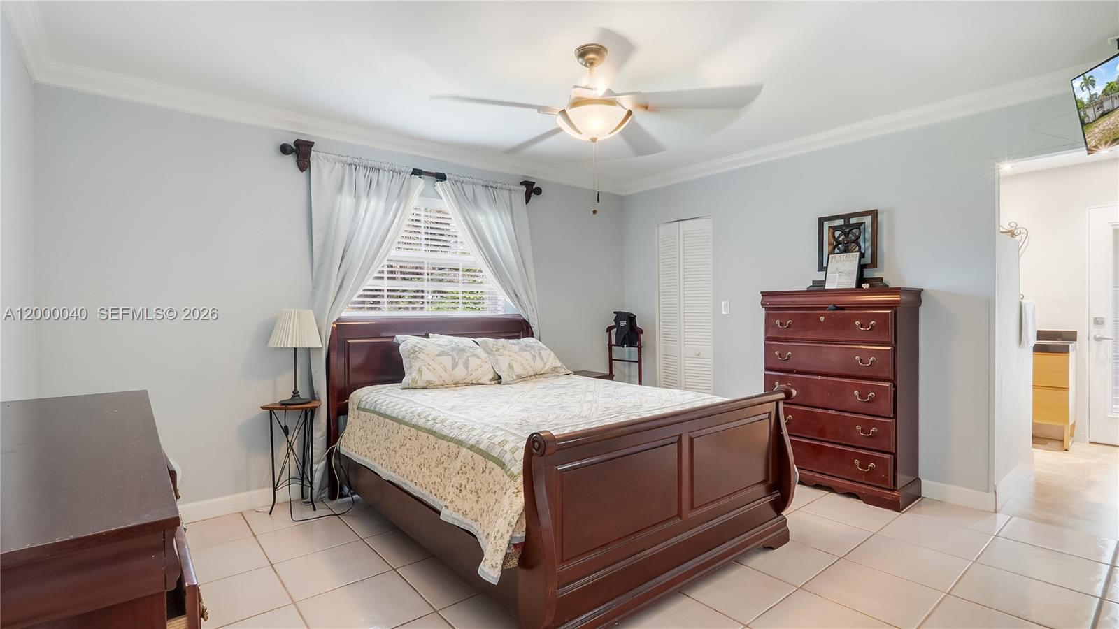 4020 Southwest 2nd Street Plantation, FL 33317 - Photo 21 of 43 a bedroom with a bed and a dresser