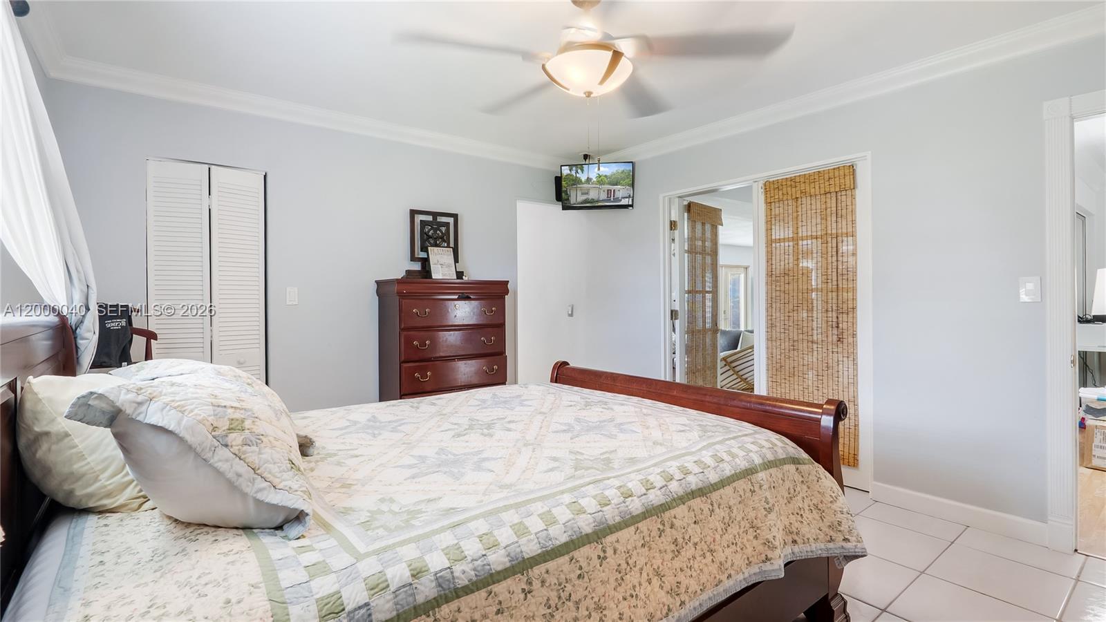 4020 Southwest 2nd Street Plantation, FL 33317 - Photo 22 of 43 a bedroom with a bed and wooden floor