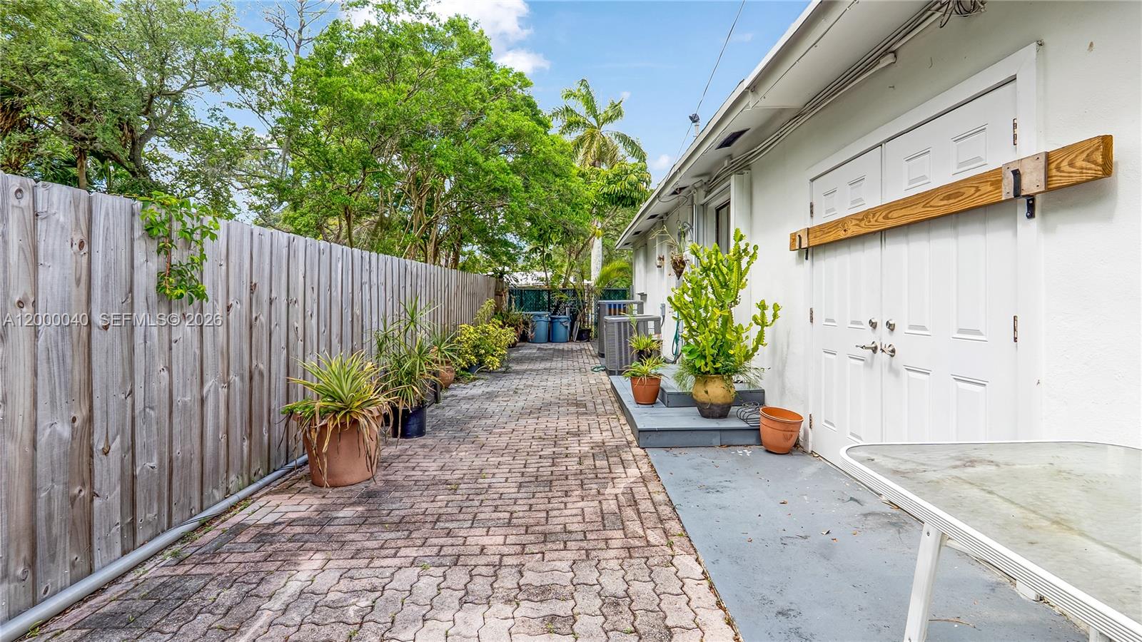 4020 Southwest 2nd Street Plantation, FL 33317 - Photo 30 of 43 a view of a backyard with potted plants