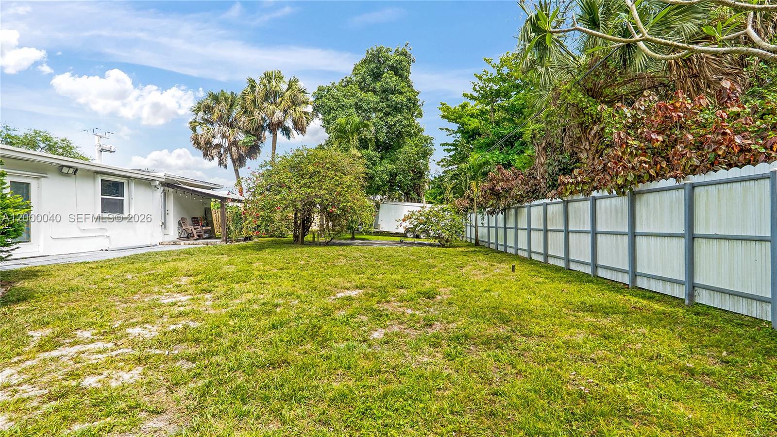 4020 Southwest 2nd Street Plantation, FL 33317 - Photo 33 of 43 a view of house with backyard and trees