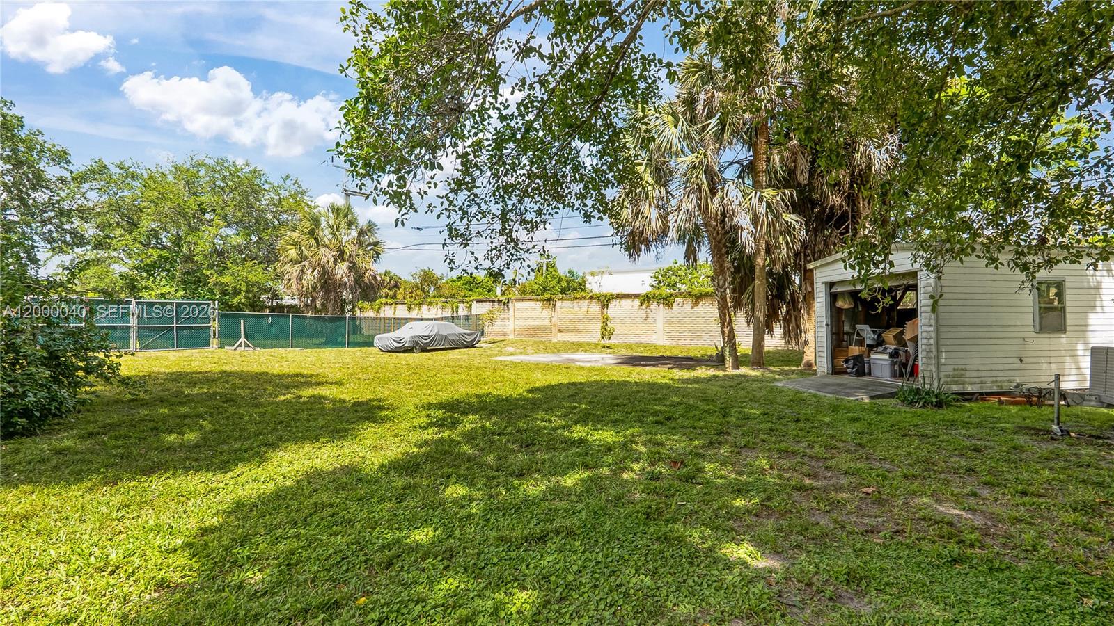 4020 Southwest 2nd Street Plantation, FL 33317 - Photo 35 of 43 a view of yard with swimming pool and green space