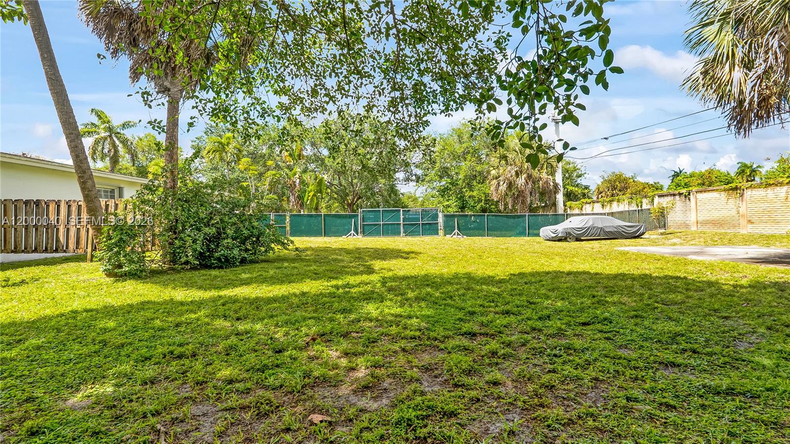 4020 Southwest 2nd Street Plantation, FL 33317 - Photo 36 of 43 a view of yard with swimming pool and green space