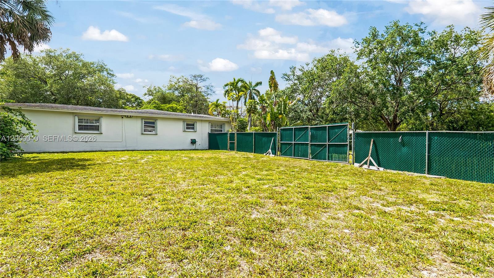 4020 Southwest 2nd Street Plantation, FL 33317 - Photo 38 of 43 a view of a house with a backyard and a garden