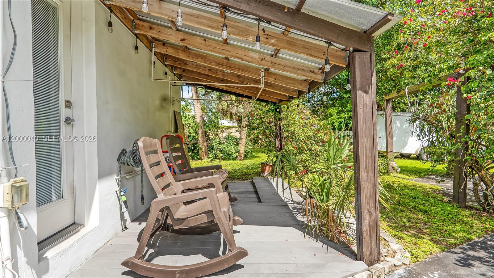 4020 Southwest 2nd Street Plantation, FL 33317 - Photo 39 of 43 a view of a patio with table and chairs and potted plants