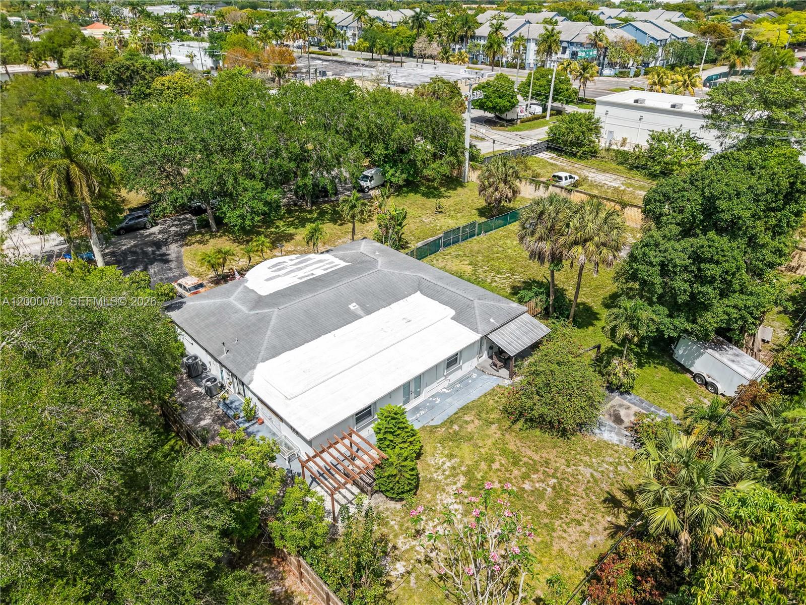 4020 Southwest 2nd Street Plantation, FL 33317 - Photo 4 of 43 an aerial view of a house with a yard swimming pool outdoor seating and yard