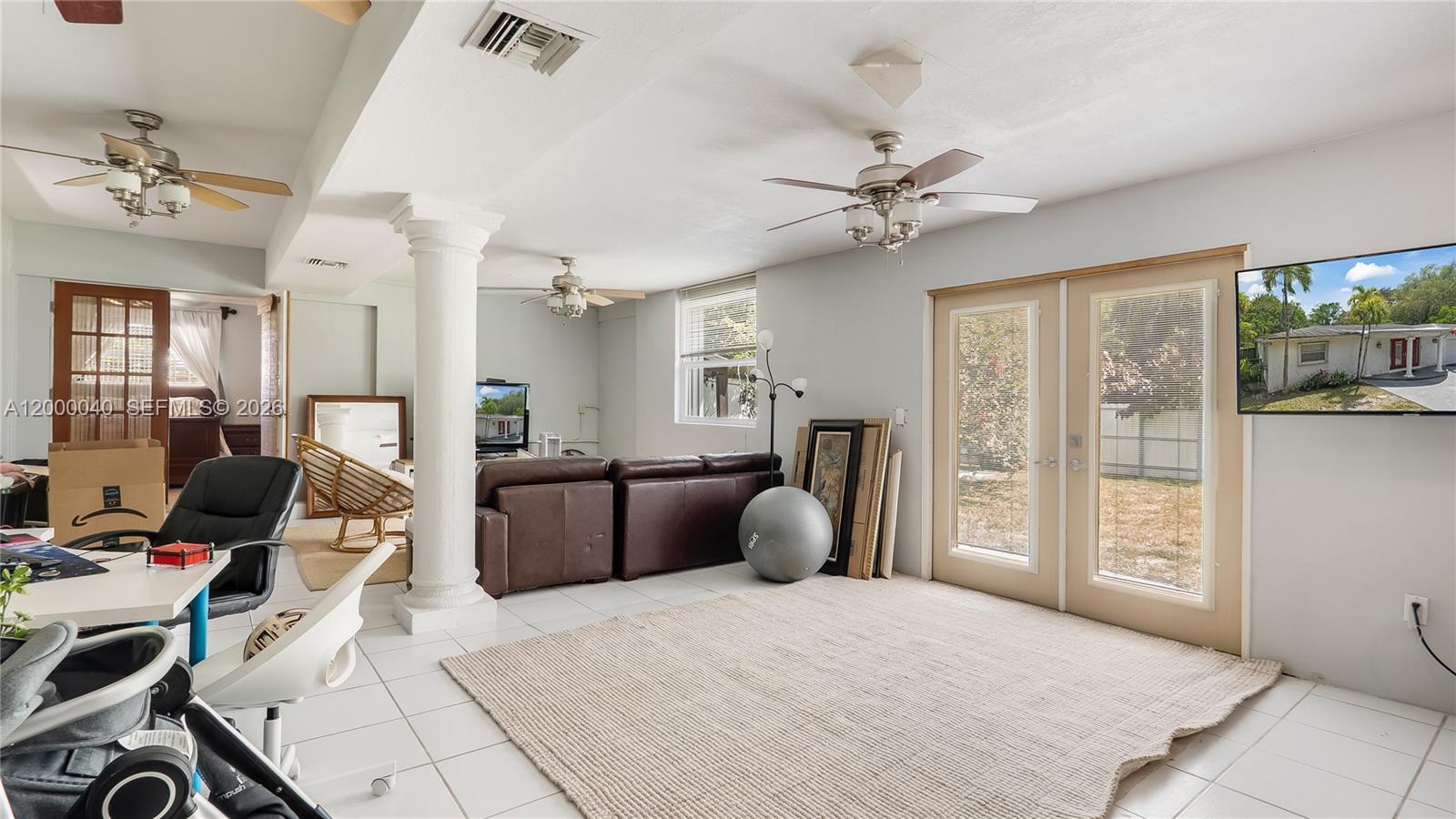 4020 Southwest 2nd Street Plantation, FL 33317 - Photo 42 of 43 a bedroom with furniture and a chandelier