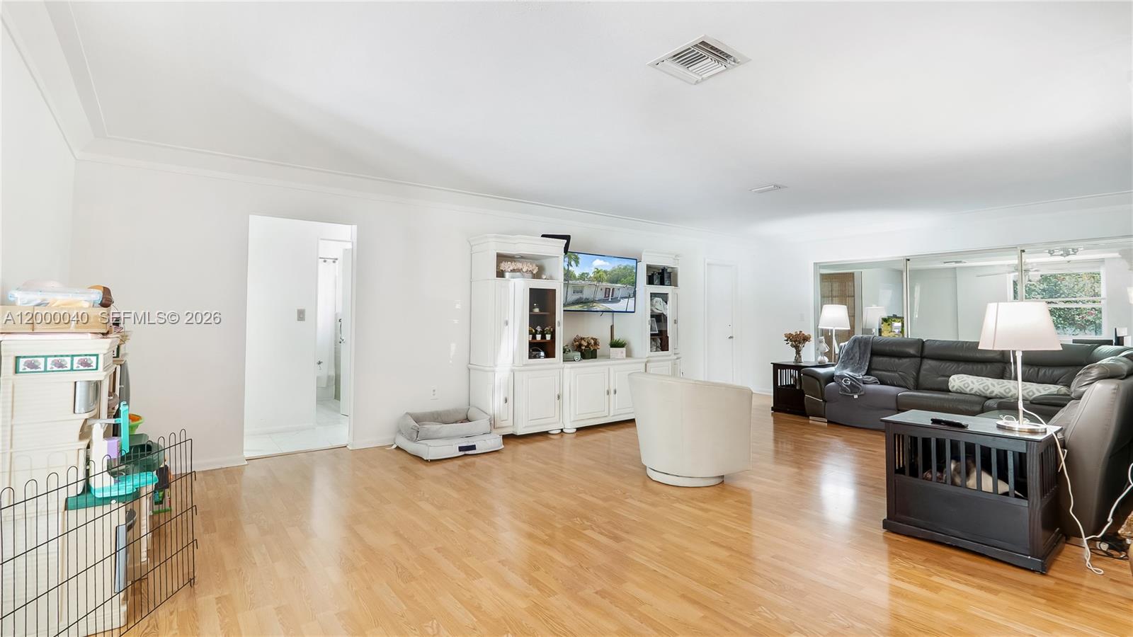 4020 Southwest 2nd Street Plantation, FL 33317 - Photo 10 of 43 a living room with furniture and a wooden floor