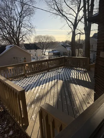 a view of outdoor space with deck and trees