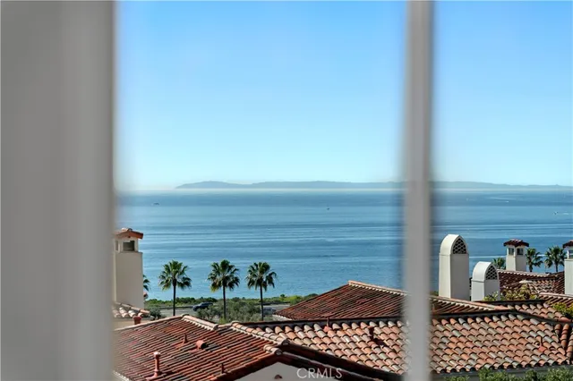 a view of a hallway with entryway and stairs