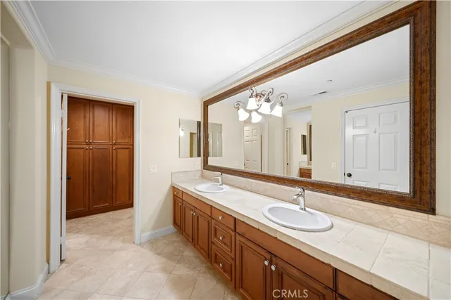 a view of an empty room with window and a wooden floor