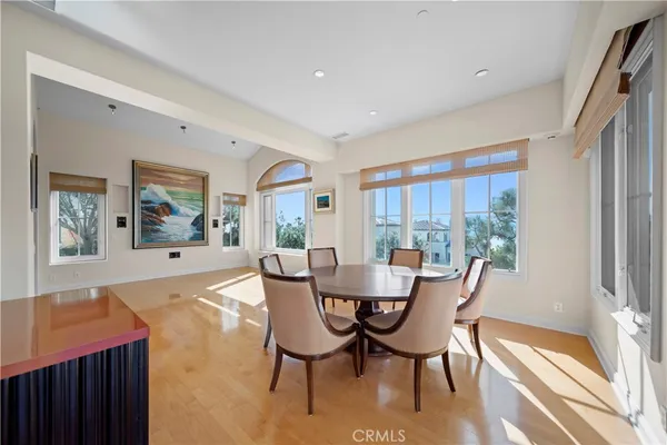 a view of a dining room with furniture wooden floor and chandelier