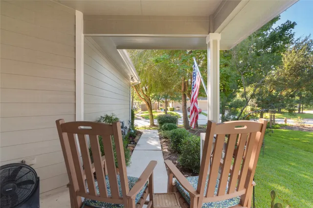 a view of balcony with furniture and garden